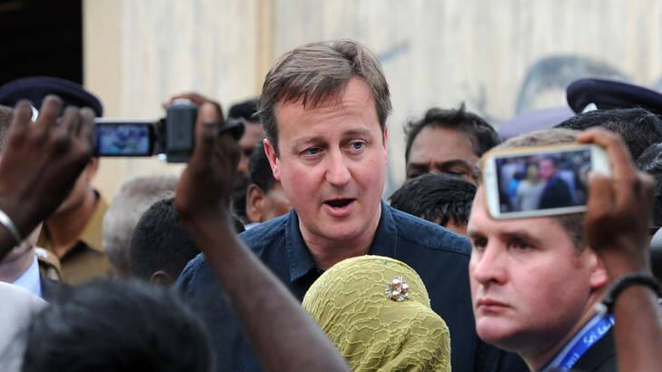 Mobbed by Tamil protesters: British Prime Minister David Cameron visits the former war-torn city of Jaffna, some 400 kilometres north of Colombo. Photo: AFP Photo