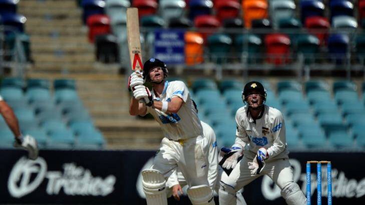 Steve Smith skies a delivery and is caught by Jason Behrendorff off the bowling of Ashton Agar. Photo: Graham Tidy 