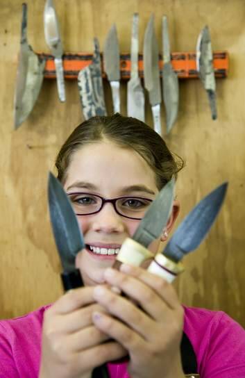 10 year old Leila Haddad makes knives for the knife show. Photo: Elesa Lee
