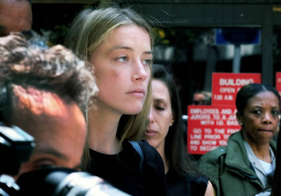 Actress Amber Heard leaves Los Angeles Superior Court in May, after giving a sworn declaration that her husband Johnny Depp threw her mobile phone at her during a fight, striking her cheek and eye. Photo: AP