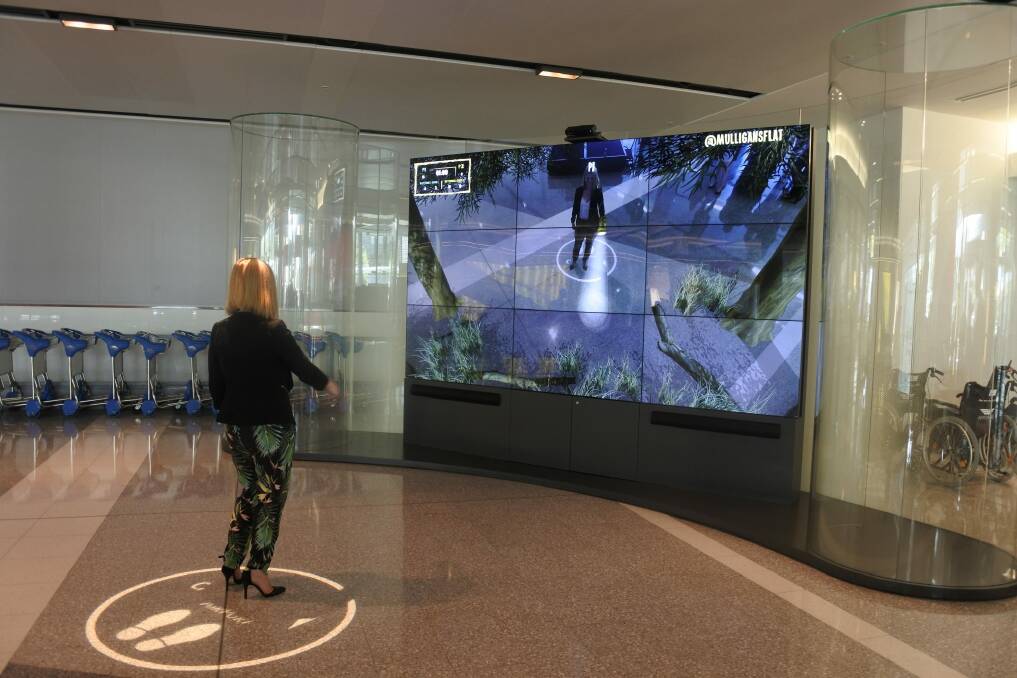 A new augmented reality feature in the arrivals terminal at Canberra Airport showcases?some of the Canberra region's tourism experiences. Photo: Clare Sibthorpe