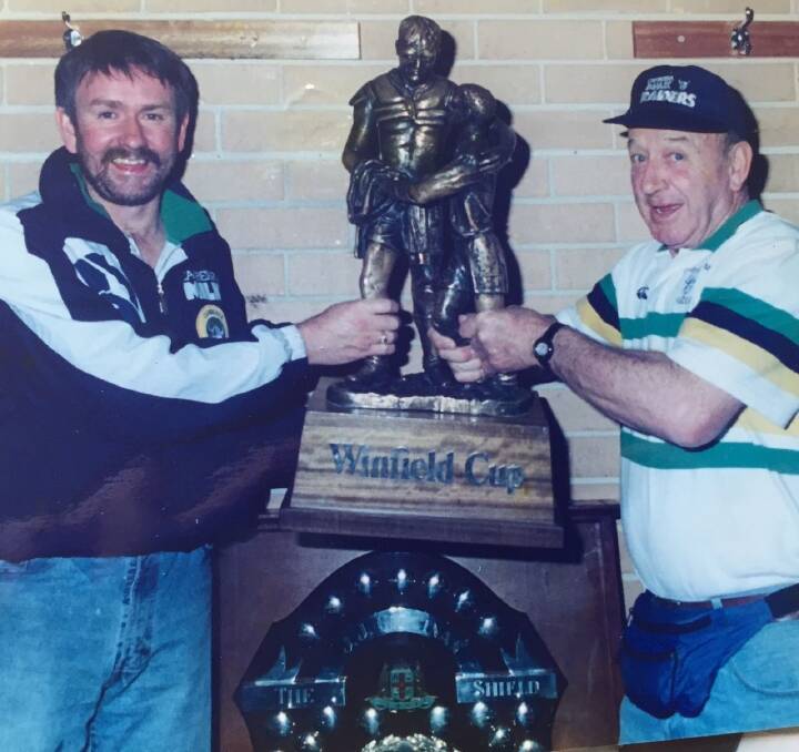 Former Raiders massage therapist Bobby Griffin, right, with the Winfield Cup. Photo: Supplied
