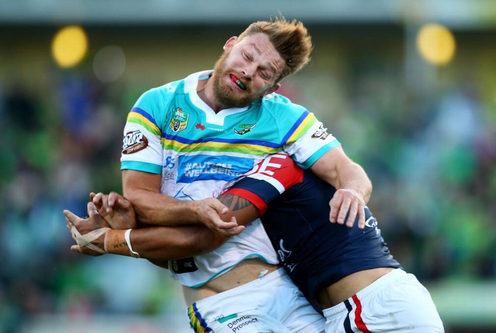 Elliot Whitehead of the Raiders is tackled after offloading. Photo: Getty