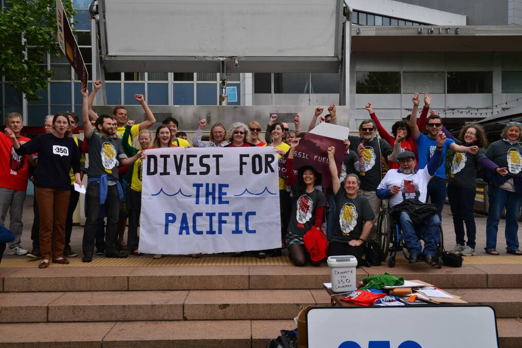 Campaign: About 40 Canberrans protested the big four banks continued investment in fossil fuel projects in Garema Place on Monday.  Photo: John P. Harvey