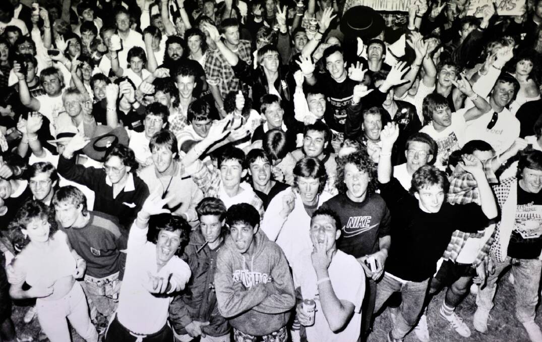 The Summernats crowd cheer in not only the New Year but also entrants in a wet T-shirt competition in December 1988. Photo: Canberra Times