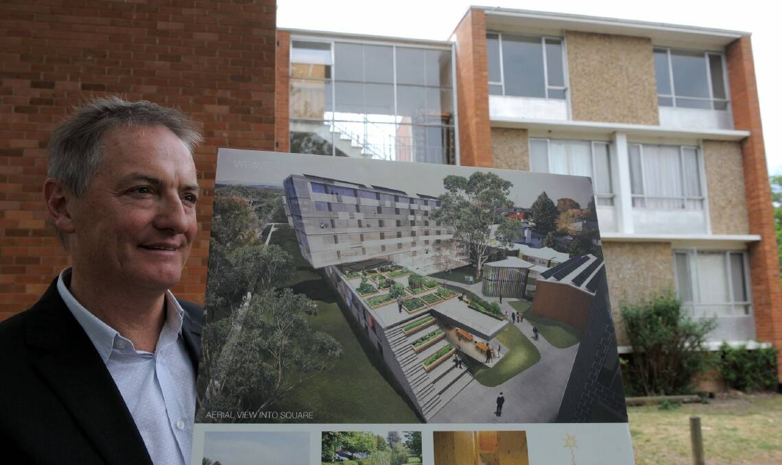Melbourne architect, John Wardle, principal of John Wardle Architects, outside the Northbourne Flats in 2011 with an illustration of his team's design for the site. Photo: Graham Tidy