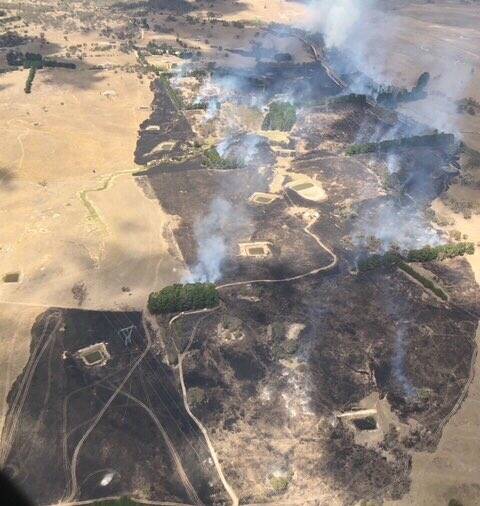 Burnt out land near Tarago, caused by an out of control bushfire. Photo: RFS