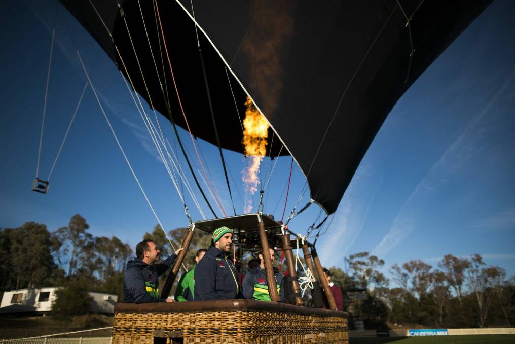Up, up, and away? The Raiders fire-up the Abode Hotels hot air balloon, said to be the largest operated in Canberra. Photo: Rohan Thomson