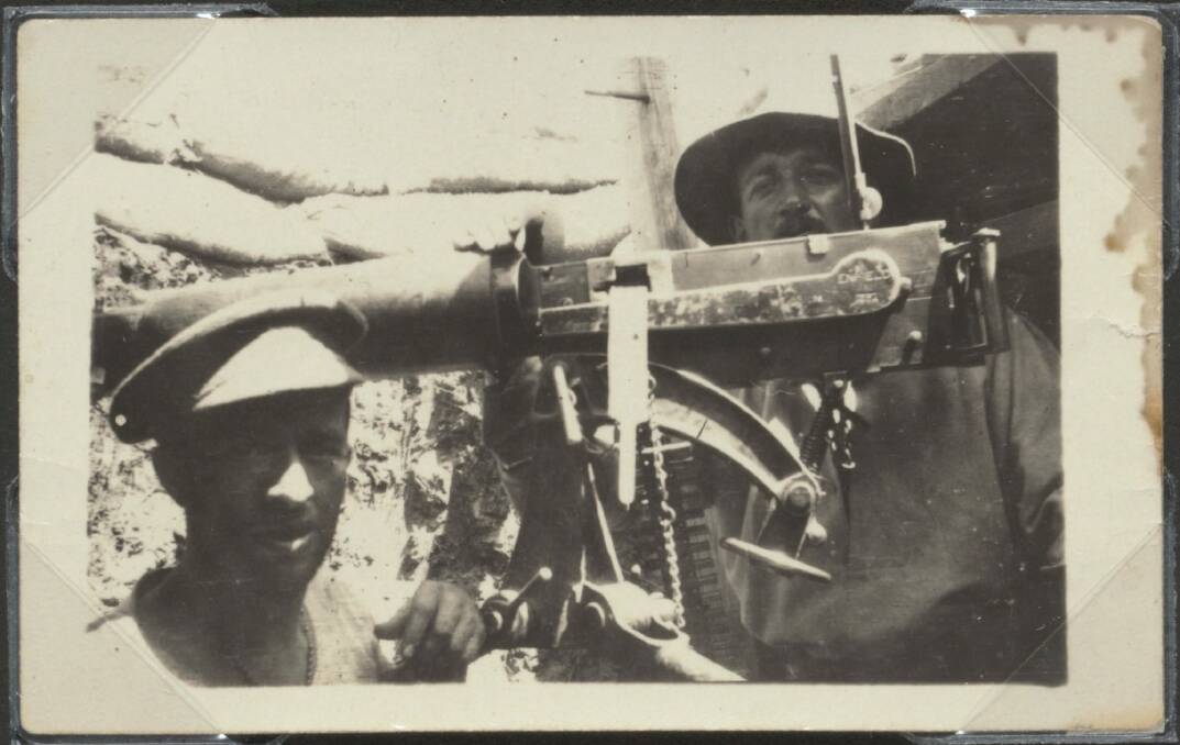 Andy Cunningham (right) in machine gun post during World War I. Photo: National Library of Australia PIC/8441/145 LOC Album 316a