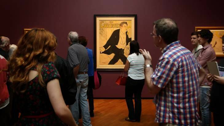 Visitors to the National Gallery of Australia look at the work Caudieux during Toulouse Lautrec exhibition in April. Photo: Jeffrey Chan