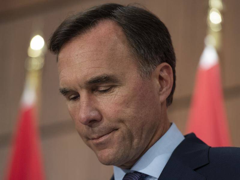 Former Canadian finance minister Bill Morneau says he's putting his name forward to lead the OECD.