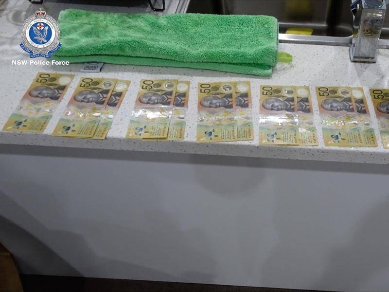 Police seized cash, jewellery, phones and laptops from Sydney units, and arrested six people.