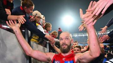 Max Gawn celebrates with Demons fans after playing a leading role in the defeat of the Geelong Cats. (Morgan Hancock/AAP PHOTOS)