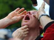 A pepper-sprayed protester at an anti-lockdown protest in Melbourne in October 2020. (James Ross/AAP PHOTOS)