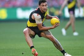 Richmond's Tim Taranto is expected to miss up to eight weeks with a broken wrist. (Julian Smith/AAP PHOTOS)