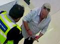 The moment security attempted to stop the suspected offender leaving the store. Picture supplied