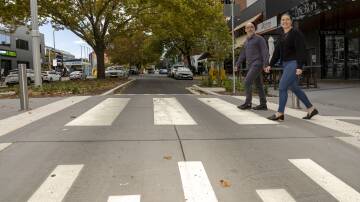 Braddon local Amy Jelacic, right, with Paris Lord on the new raised crossings in Lonsdale Street. Picture by Gary Ramage