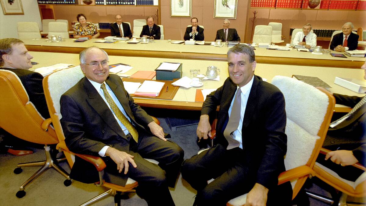 Treasurer Peter Costello, Prime Minister John Howard and Deputy Prime Minister John Anderson during a break in a Cabinet meeting, April 2001. Picture: National Archives of Australia