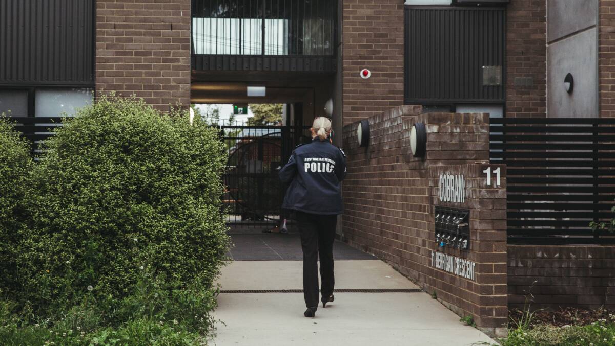 Police seen at an apartment complex at 11 Berrigan Crescent in O'Connor. Picture: Dion Georgopoulos