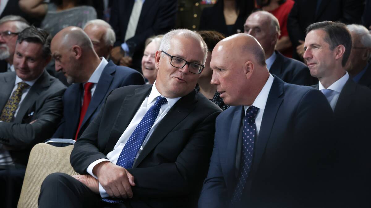 Former prime minister Scott Morrison, left, and leader of the opposition Peter Dutton at the Emperor's Birthday event held at the Japanese Ambassador's residence. Other notable figures sit behind them. Picture by James Croucher