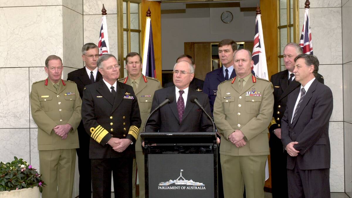 Prime Minister John Howard announcing Peter Cosgrove as the new Chief of the Defence Force at Parliament House in Canberra in May 2002. Picture supplied
