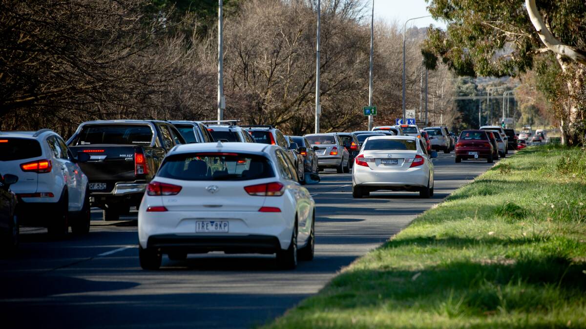 Cars line up along Northbourne Avenue in COVID testing queue as ACT going into seven-day lockdown after four cases were detected. Picture: Elesa Kurtz