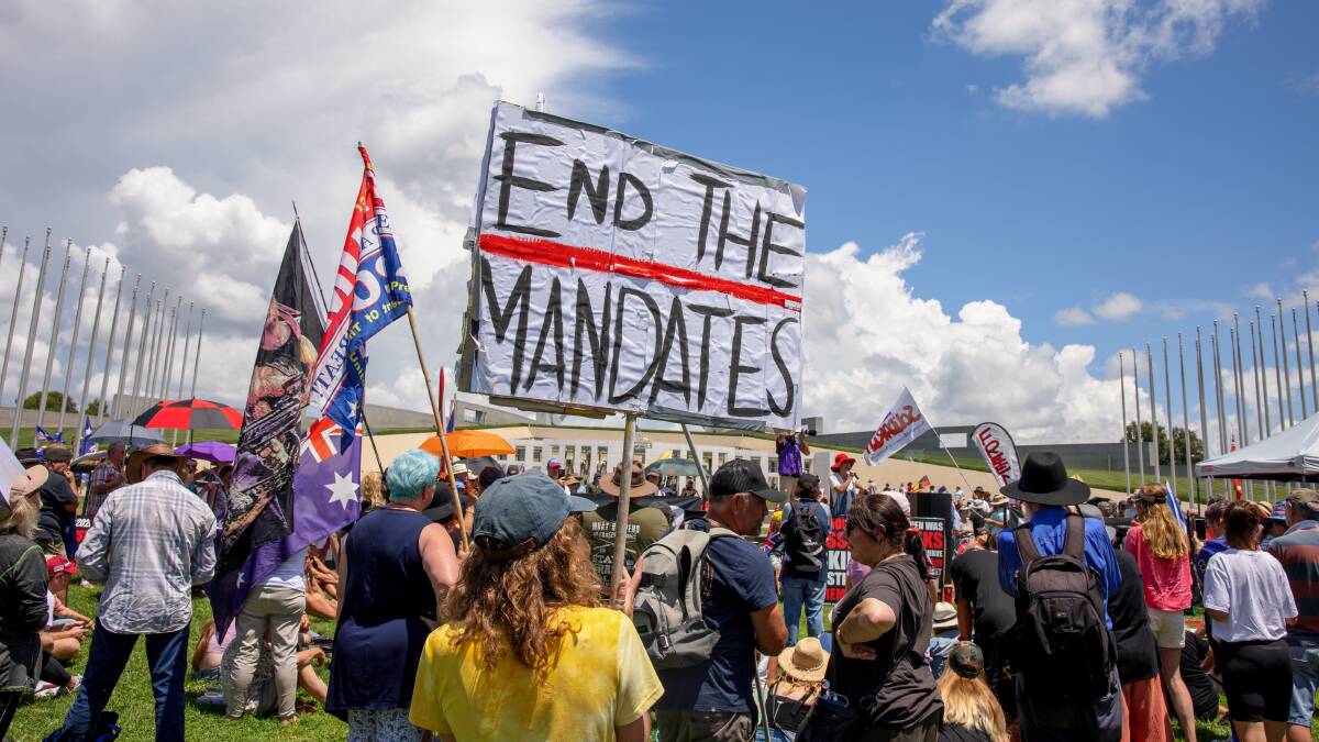 Hundreds of protesters gathered outside Australian Parliament House on Monday as part of a Millions March Against Mandatory Vaccination rally. Picture: Sitthixay Ditthavong