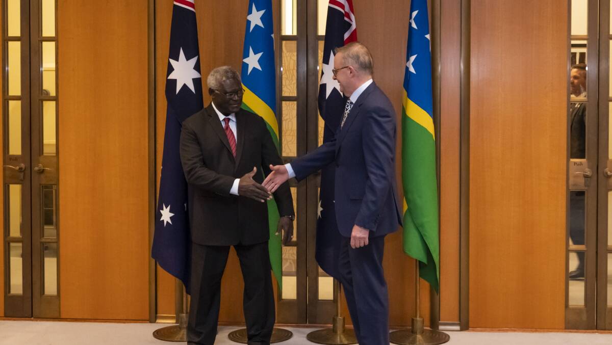 Solomon Islands Prime Minister Manasseh Sogavare (left) greeting Prime Minister Anthony Albanese (right). Picture Getty Images