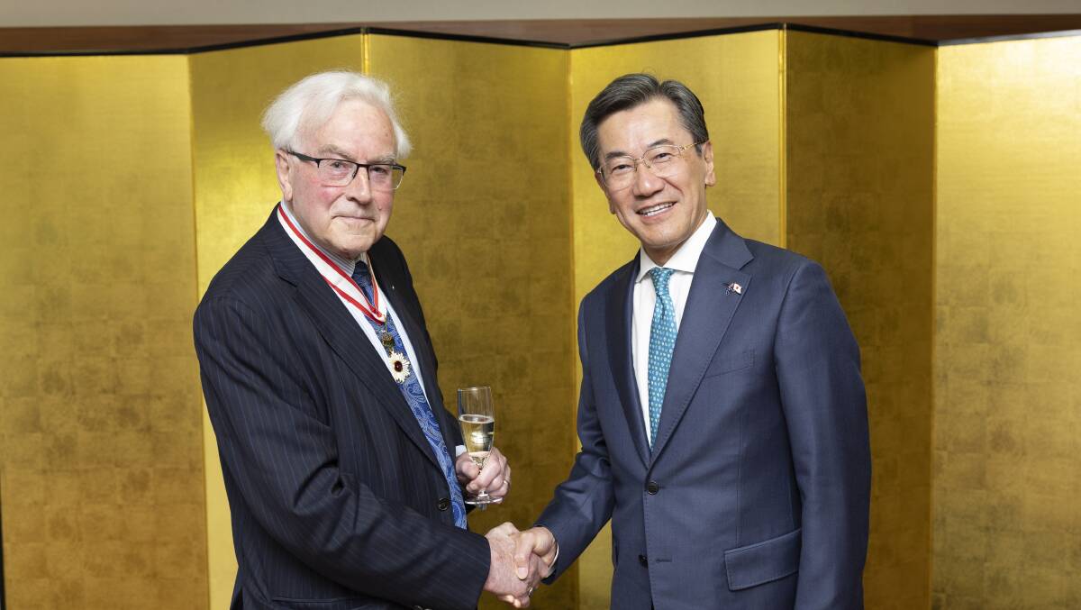 Australian National University emeritus professor Dr Paul Dibb AM was awarded an Order of the Rising Sun medal by Japanese ambassador Shingo Yamagami. Picture by Keegan Carroll