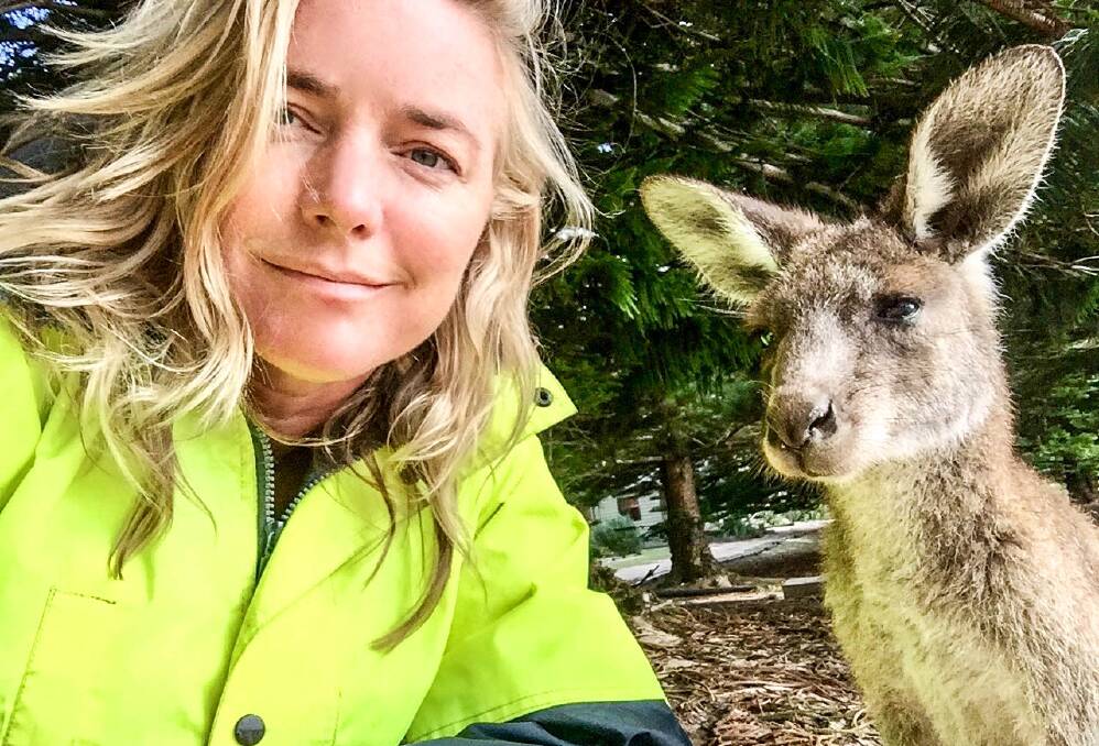 Behind the scenes: Karina Holden takes a selfie with an Eastern Grey Kangaroo while shooting film 'After the Fires'. 