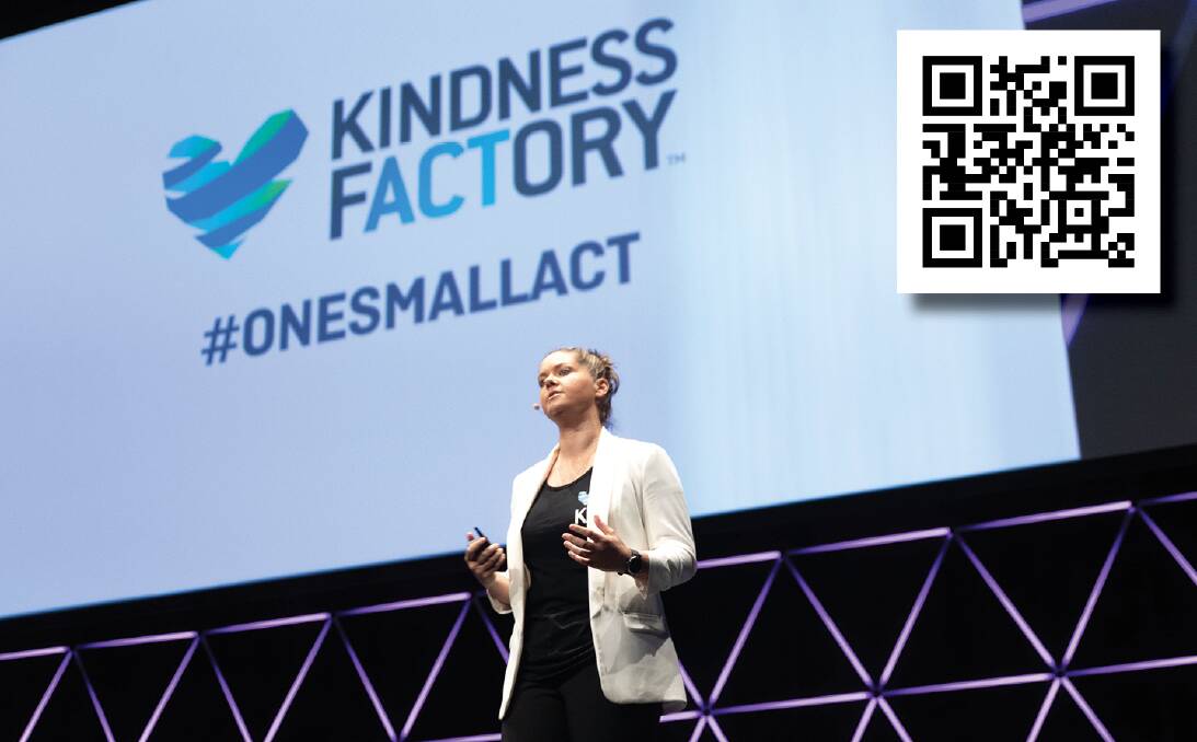 Kath Koschel at a Kindness Factory event. Scanning the KR - Kindness Response - code will prompt an act of kindness. Photo: Supplied