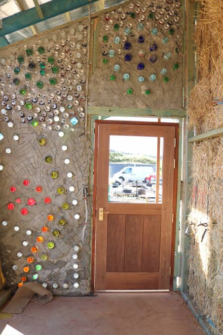 Reduce, Reuse, Recycle: The bottles that reinforce the cob walls create a stained-glass effect. Images: Supplied