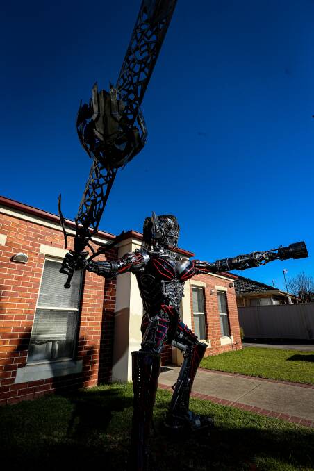 ON DISPLAY: The home of Jordan Hiles and Georgia Ellis has had a large metal transformer statue on the front lawn for the past month. Pictures: JAMES WILTSHIRE.
