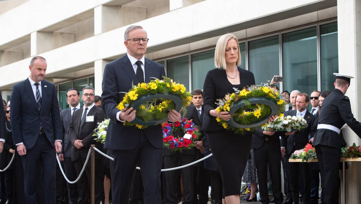 Prime Minister Anthony Albanese, and Minister Katy Gallgher lay a wreath. Picture by Elesa Kurtz