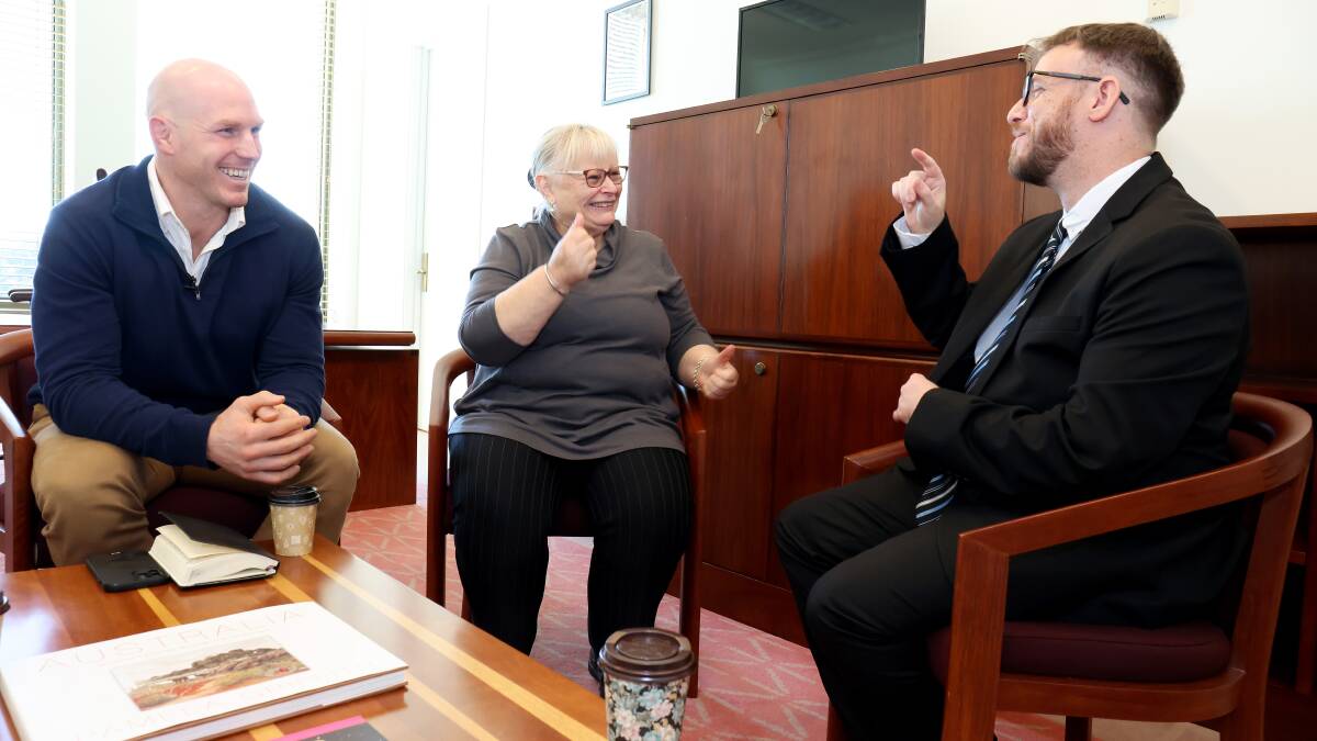 Senator David Pocock in his office at Parliament House with AUSLAN translator Mandy Dolejsi and Jacob Clarke. Picture: James Croucher