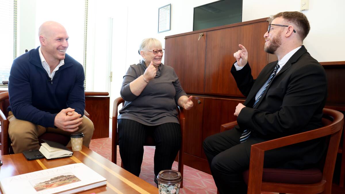 Senator David Pocock in his office at Parliament House with AUSLAN translator Mandy Dolejsi and Jacob Clarke. Picture: James Croucher