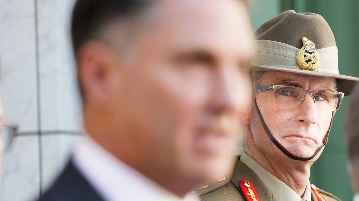 Chief of the Defence Force Angus Campbell listens to defence minister Richard Marles. Picture by Sitthixay Ditthavong