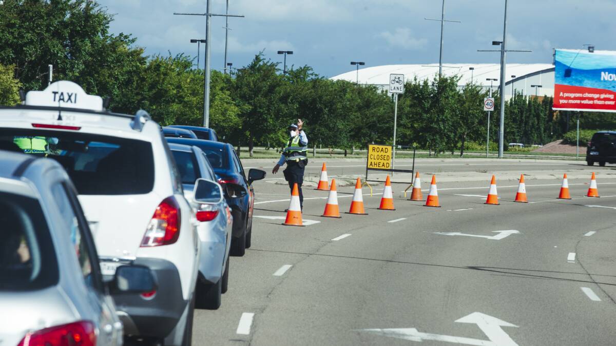 Road closures caused traffic delays coming in and out of Canberra Airport on Sunday as measures were in place against protesters entering with their vehicles. Picture: Dion Georgopoulos