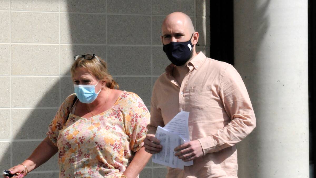 James Lawrence Michael Raftery (right), 33, walks out of the ACT courts building on Thursday with his mother. Picture: Blake Foden