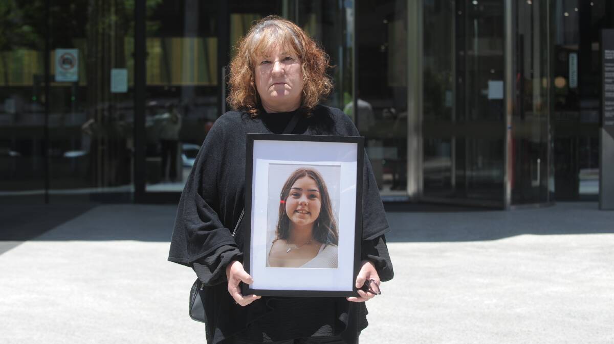 Maria Mura holding a framed photo of her 16-year-old granddaughter, Alexis Sagghy, outside court after the sentencing of Hamdan. Picture by Toby Vue