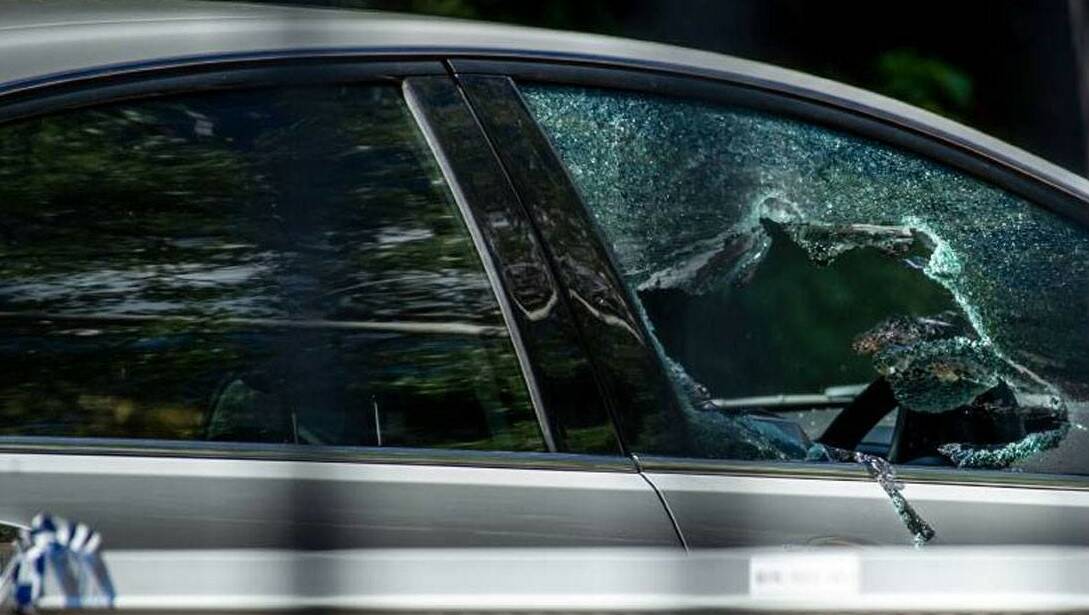 The shattered driver's window after Forrest shot through it.