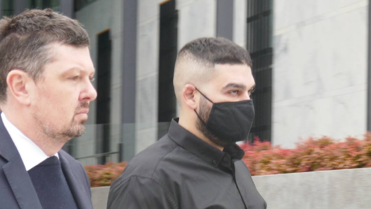 Omar Haddara, right, with his lawyer Michael Kukulies-Smith outside the ACT courts building in August. Picture by Toby Vue