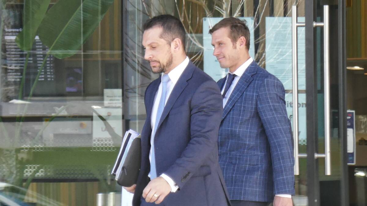 Edmund Scott Krizaic (right) walks out of court behind his lawyer, James Maher, after being given a fully suspended jail term. Picture: Toby Vue