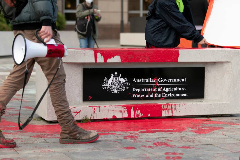 Three Extinction Rebellion members were charged with defacing public property at the Department of Agriculture. Two were sentenced while one had his charge dismissed. Picture: Keegan Carroll