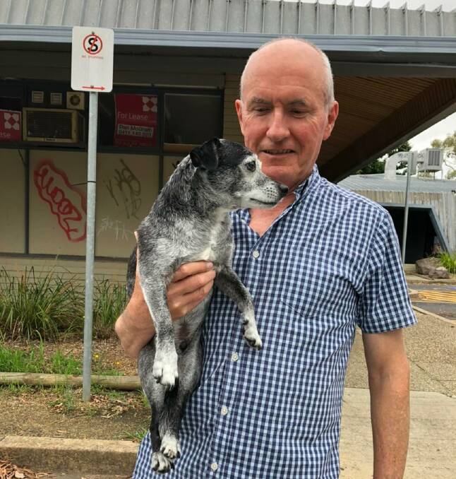 Samson, 11, pictured with his Ms Green's father, Mark Waldron, was found after Arthur & Co. Pet Detectives became involved in the search on Saturday. Picture: Supplied