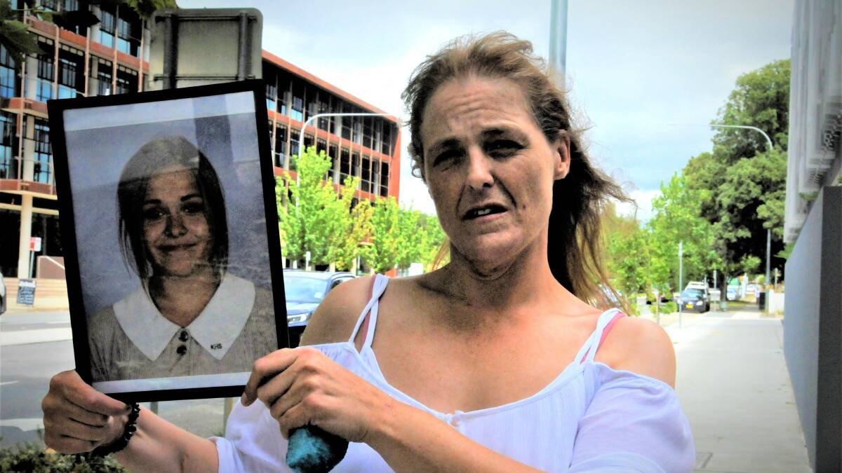 Sharon Moore with a photograph of daughter Charli Powell outside the Queanbeyan courts in March. Picture by Blake Foden