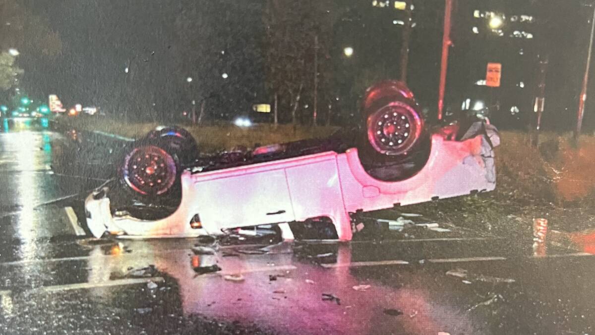 The Ford Ranger on its roof, which police described as being "completely crushed". Picture: Supplied