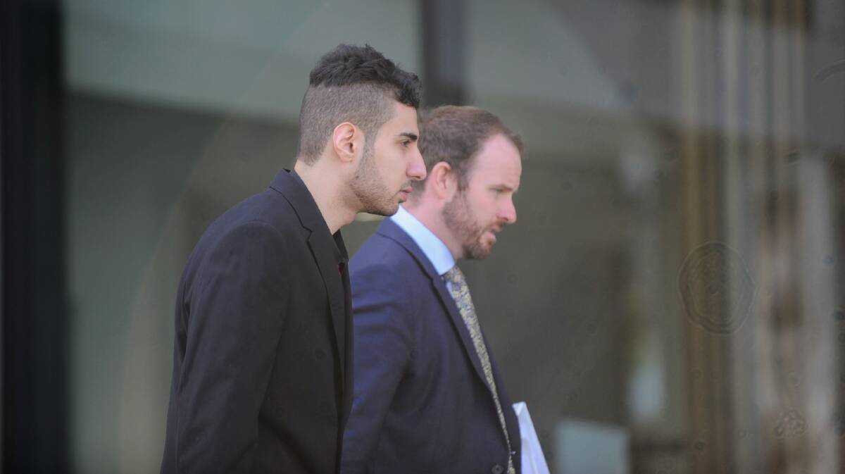 Ameen Hamdan (left) with one of his lawyers, Jacob Robertson, outside court during trial. Picture by Toby Vue