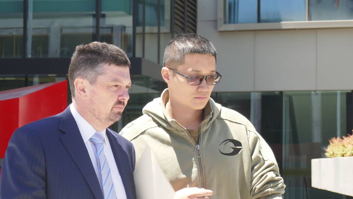 Wei Wang (right) with his lawyer Michael Kukulies-Smith walking out of the ACT courts building after his bail application was successful. Picture by Toby Vue