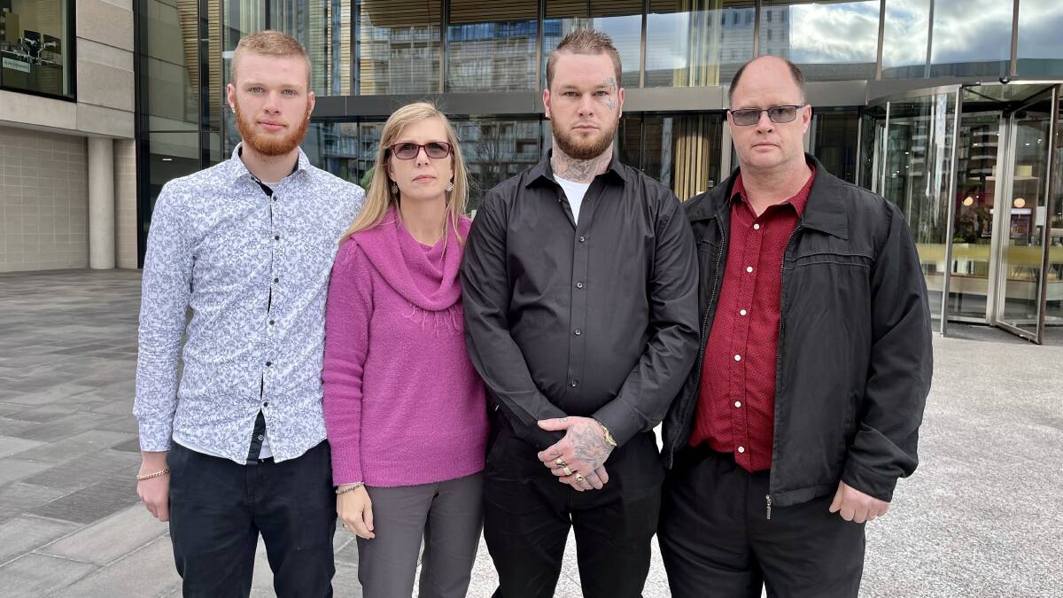 Dylan Yates (second from right) with his brother, Kyle, and parents, Marion and Rod Yates, outside the ACT courts building after their case against the NSW government was settled on Thursday. Picture: Toby Vue